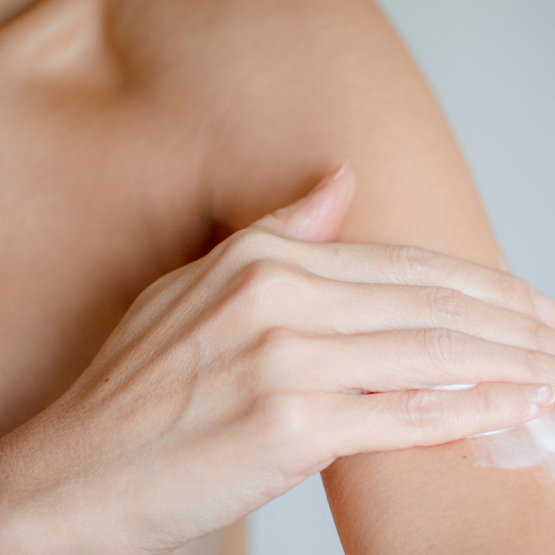 woman applying cream